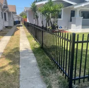Black metal fence installation in Beverly Hills for residential property security and curb appeal
